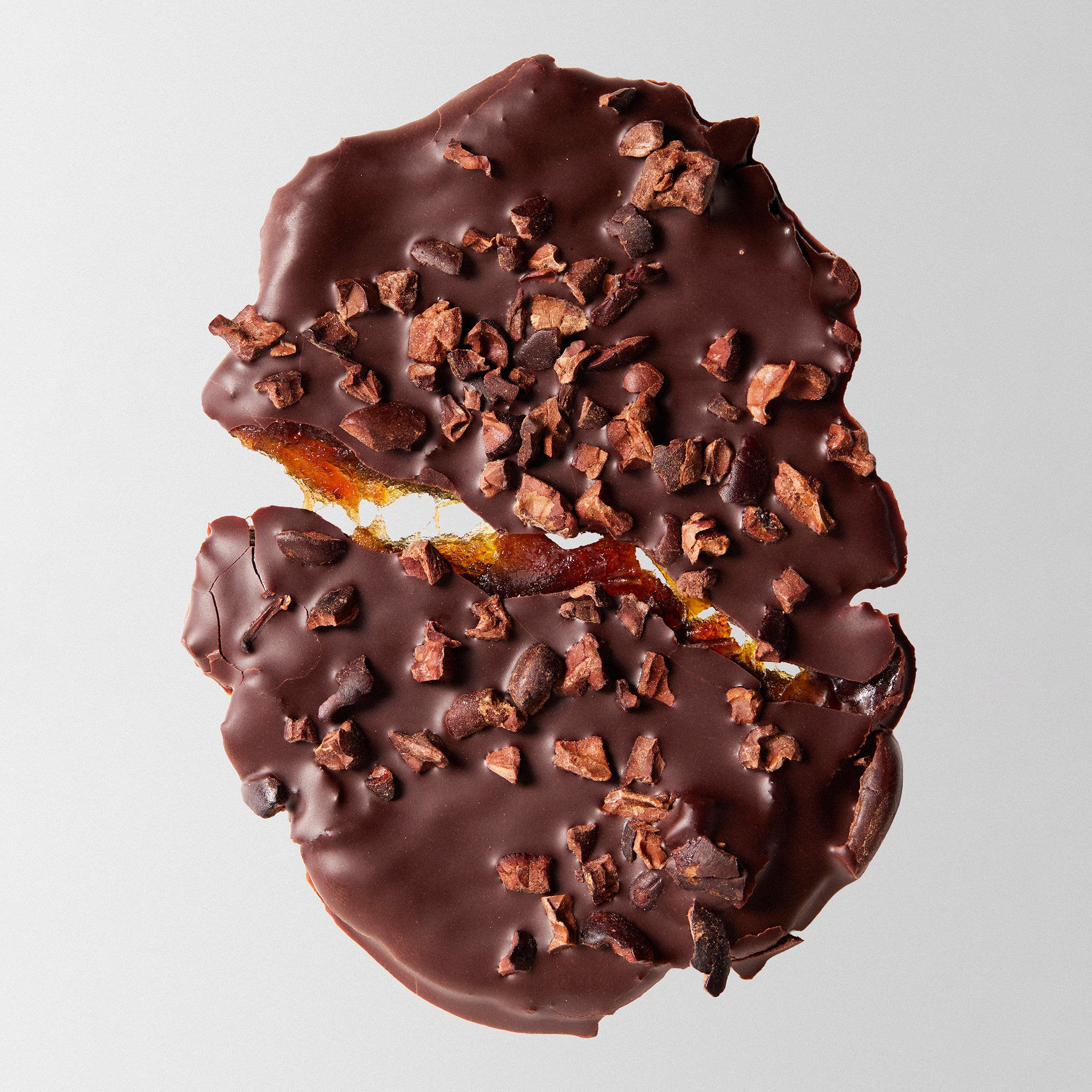Cacao Smashed Date covered in 100% chocolate and topped with cocoa